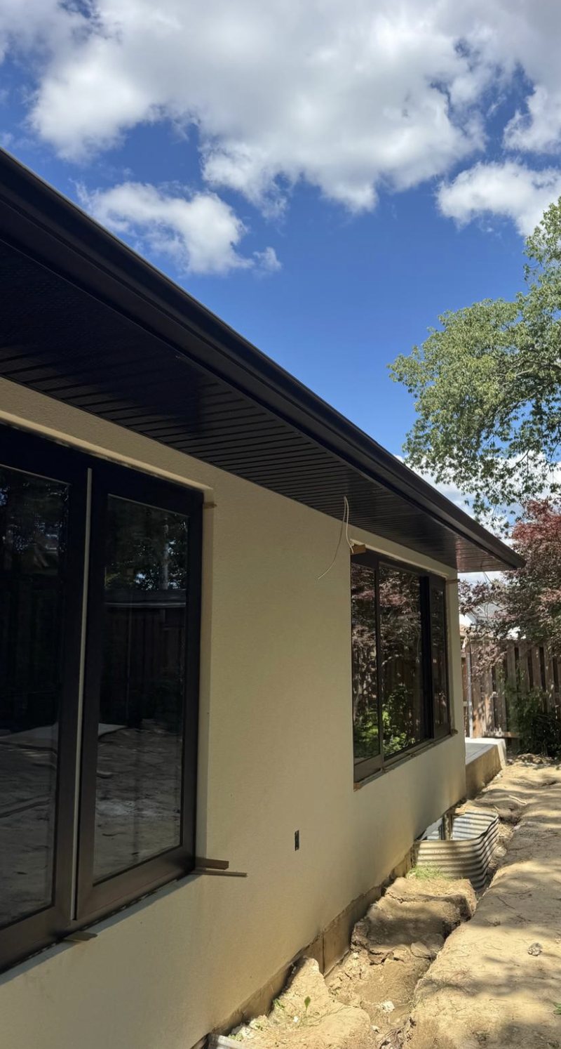 Side view detail of the installed black-framed windows