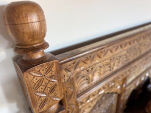 Hand-carved bed in Todd’s home in USA